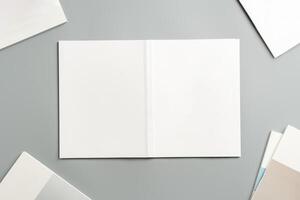 Empty White Sheet of Paper Positioned at an Angle on Light Gray Surface photo