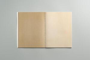 Open Blank Notebook on Minimalist Desk Surface in Soft Natural Light During Daytime photo