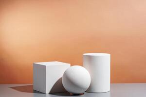 White geometric shapes arranged stylishly on a soft peach background in a minimalist setting photo