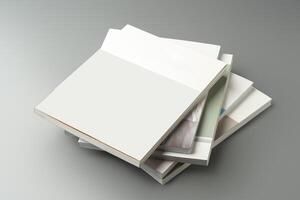 A stack of blank notebooks arranged neatly on a simple grey background photo