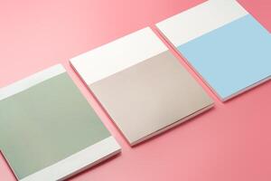 A Collection of Blank Papers Stacked on a Pink Surface for Creative Projects photo