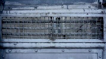 Old metal door with barbed wire. Abstract background for design. photo