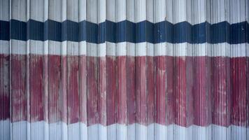 Abstract background of red and blue stripes on a metal wall. photo