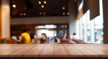 Empty wooden table top with lights bokeh on blur restaurant background. photo