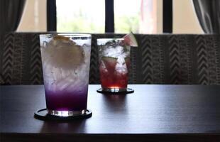 Lemon and blueberry soda in a glass of ice. photo