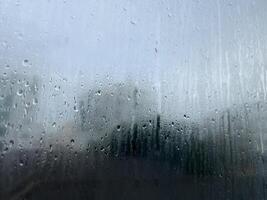 misted glass with droplets of water draining down photo