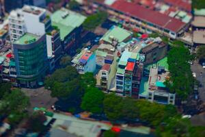 A high angle view of miniature cityscape at the downtown in Ho Chi Minh daytime tiltshift photo