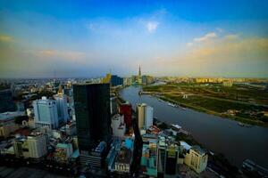 A dusk panoramic cityscape near Saigon river in Ho Chi Minh high angle photo