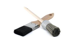 Paintbrushes isolated on white showcasing different bristle styles for various painting techniques photo