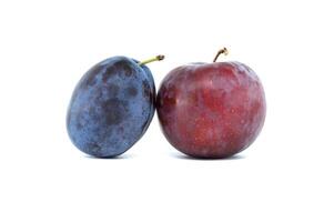 Fresh plums on a white background, highlighting vibrant natural colors photo