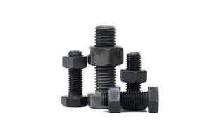 Closeup of assorted metal bolts and nuts isolated on a white background photo