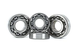 Set of metal ball bearings in various sizes isolated on a white background photo