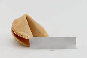 Chinese Fortune Cookie with blank paper for prediction message. photo
