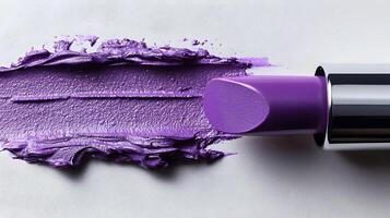 Vibrant Lavender Lipstick Tube with Visible Texture and Smeared Makeup photo