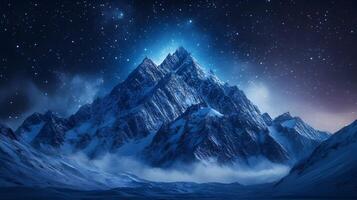 Captivating Snow Capped Mountain Range Beneath a Starry Night Sky photo
