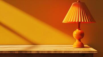 Table lamp with yellow lampshade stands on wooden table. Copyspace. Yellow back photo
