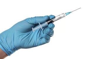 Syringe in the hand of a doctor isolated on a white background. photo