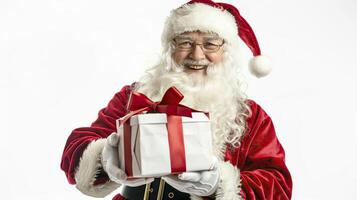 Santa Claus holding gift box isolated on white background. photo