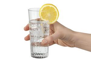 Glass of water with lemon in hand isolated on a white background. photo