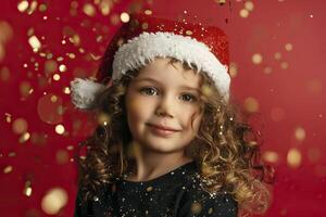 Portrait of a beautiful little girl in a Santa hat on a red background. photo
