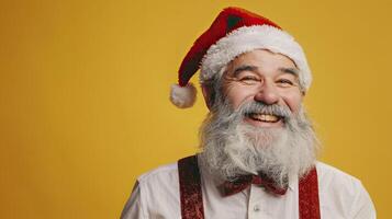 Happy Santa Claus on yellow background. photo