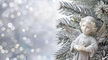 Christmas greeting card with silver angel on blurred bokeh background. photo