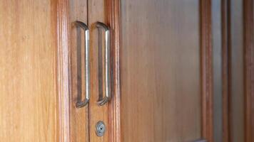 A wooden door with a handle and a handle video