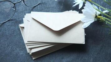 A pair of glasses and a pair of envelopes on a table video