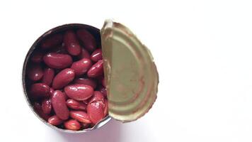 A tin of red beans with a lid open video