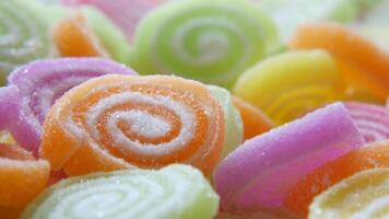 A close up of colorful candy that is arranged in a circle video