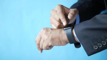 A man in a suit is checking his watch video