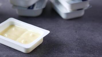 A container of yogurt sits on a table video