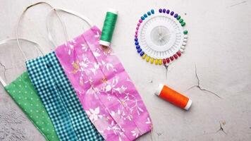 A sewing bag with thread, scissors and fabric video