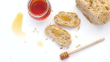 Bread with honey and honey on a white background video