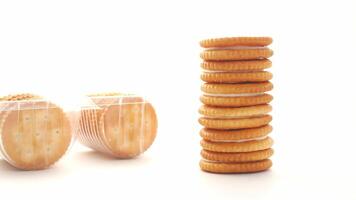 A stack of crackers next to a box of crackers video