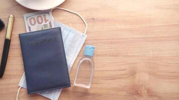 Passport, money, and a pen on a wooden table video