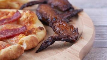 A pizza with bacon and cheese on it video