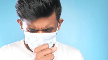 A man wearing a mask and coughing video
