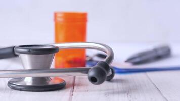 A stethoscope and a pen on a table video