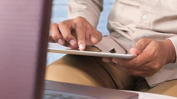 A man is using a tablet computer video