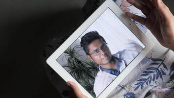 A man using an ipad to call his mother video