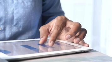 A person is using a tablet computer with a graph on it video