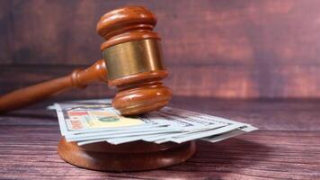 Judge gavel and money on wooden table video