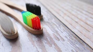 Two toothbrushes with different colored bristles video