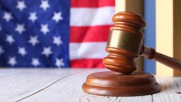 Judge gavel on books and american flag video