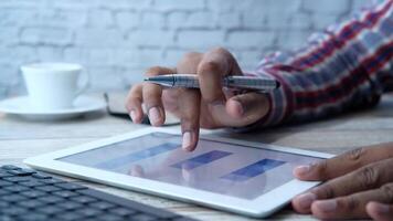 A person is using a tablet with a pen on it video