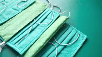 Three green face masks with white polka dots video
