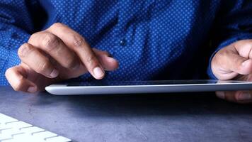 A person is using a tablet computer with their hands video