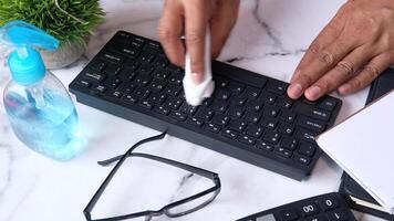 A person is using a keyboard to clean it video