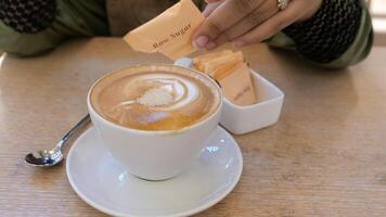 A person is pouring a latte into a cup video